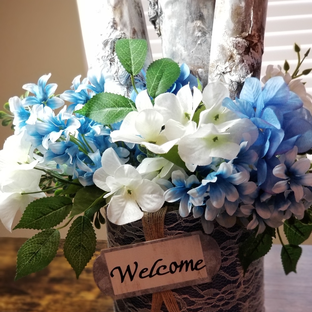 Handcrafted Artificial Flower Arrangement with Faux Birch logs.